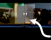 Section of the timeline panel, with an arrow pointing to the transition between two clips.