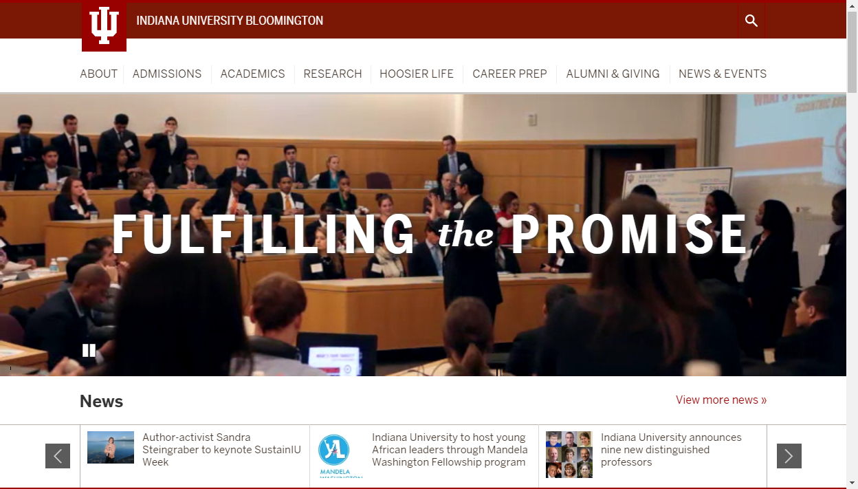 Screen capture of the Indiana University Bloomington website, focusing on the banner graphic, which is photograph of a meeting room with the words “Fulfilling the Promise” superimposed over the top of the image.
